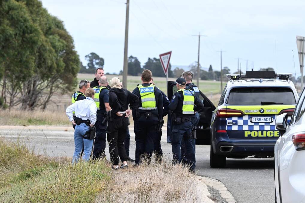 Police on the Western Highway near the Ballarat Saleyards as officers tracked a vehicle with two people inside on April 30, 2024. Picture by Lachlan Bence.