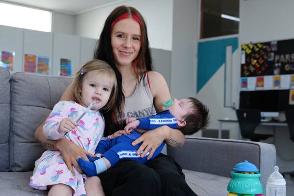 Aimeelia with Neveah, 18 months, and Jaxon, two months, in the classroom of the Yuille Park Community College's Young Parents Program. Picture by Kate Healy