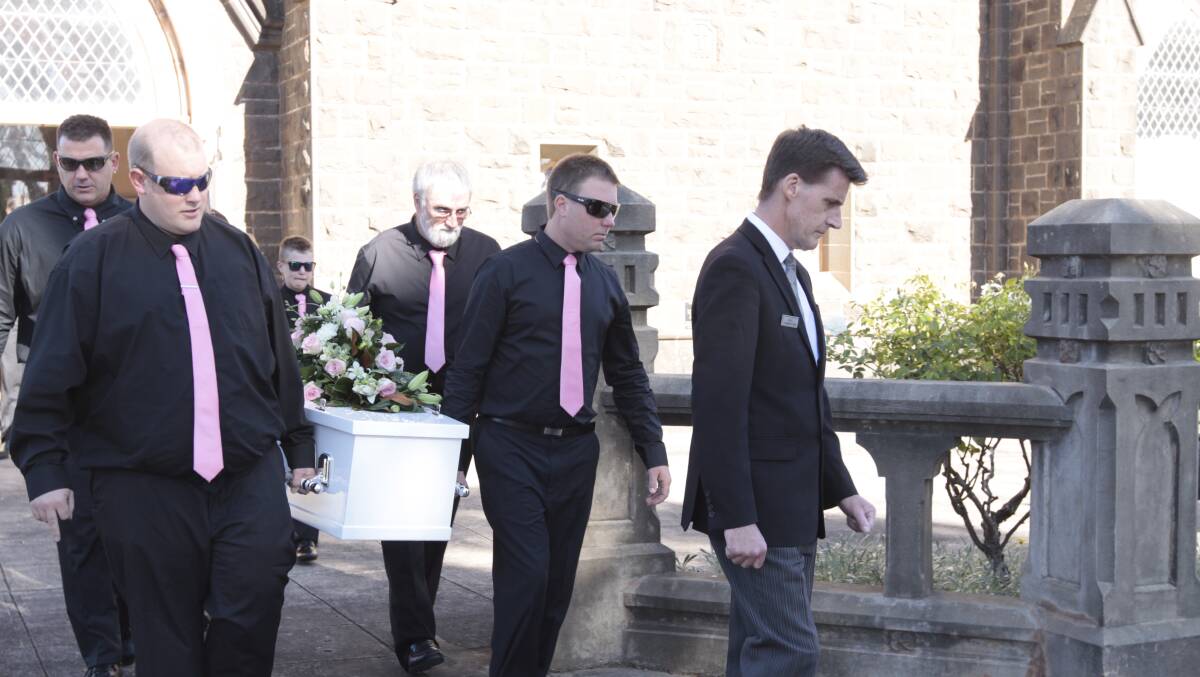 Tragic: Family members carry out eight-year-old Hannah Rhook's coffin after her funeral at Hamilton. She died on March 29 after suffering a stroke about three weeks earlier.