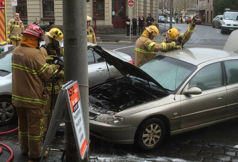 WHERE THERE IS SMOKE: Fire fighters extinguished a car fire in Lydiard Street, near her Majesty's Theatre on Thursday morning. Picture: Hayley Sandlant. 