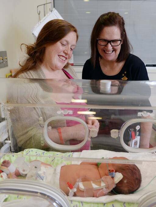 SATISFIED: St John of God Ballarat Hospital patient Claire Davenport with son Hardy Newman, two-days-old, with midwife Leonie Sewart. Picture: Kate Healy.