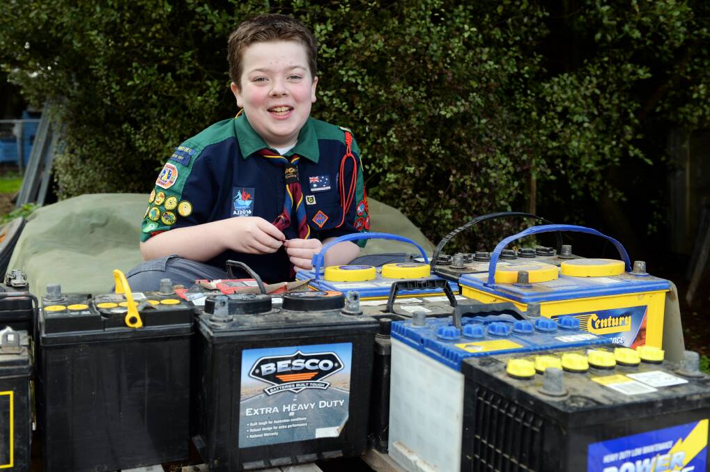 EAGER: Scout Corey Loader, 14, is selling used car batteries to raise money for his carer to attend the Australian Jamboree next year. Picture: Kate Healy. 