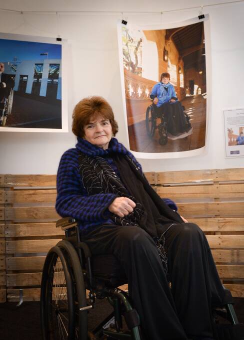 ADVOCATE: Campaigner for disability rights Joan Hume with a portrait of herself by Belinda Mason. Picture: Liz Crothers