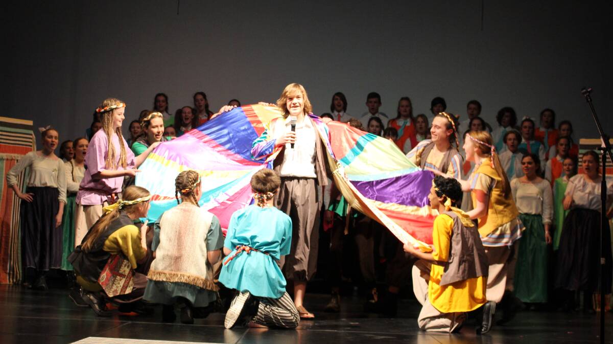 WEARING HIS COAT: Tiernan Somers (Joseph) and the cast and crew of the combined school production Joseph and the Amazing Technicolour Dreamcoat.