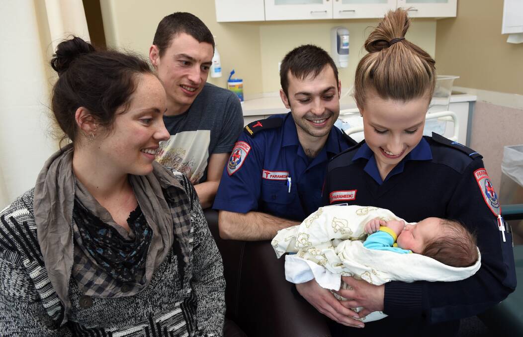 OVERJOYED: Lindy and Matt Sharkey welcomed baby Cooper into the world on Monday night. The baby was born in an ambulance with the assistance of paramedics Mitch Ridgway and Emma Dean. Picture: Lachlan Bence