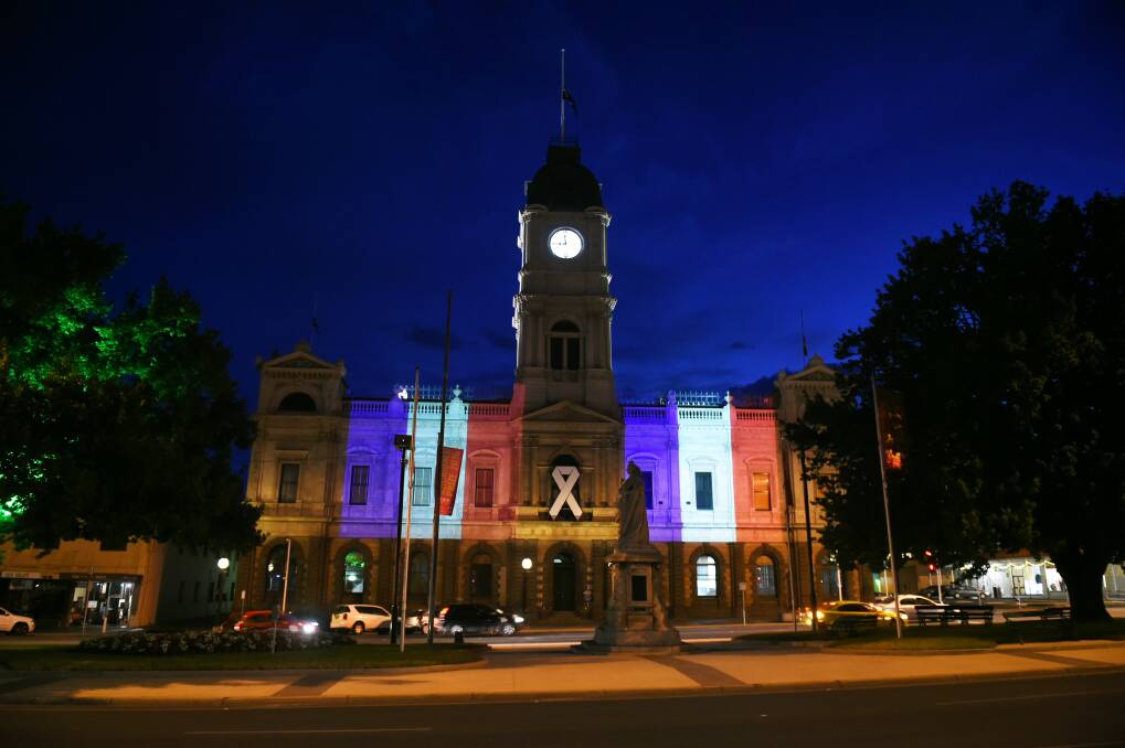 STAND UNITED: Ballarat shows its support to the people of Paris with a projection of the French flag on the Town Hall. Picture: Kate Healy