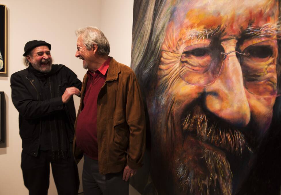WINNERS ARE GRINNERS: Bruno Jean Grasswill poses with Michael Caton after his portrait of Michael won this year's Packer's Award in the annual Archibald Prize. Picture: Shu Yeung