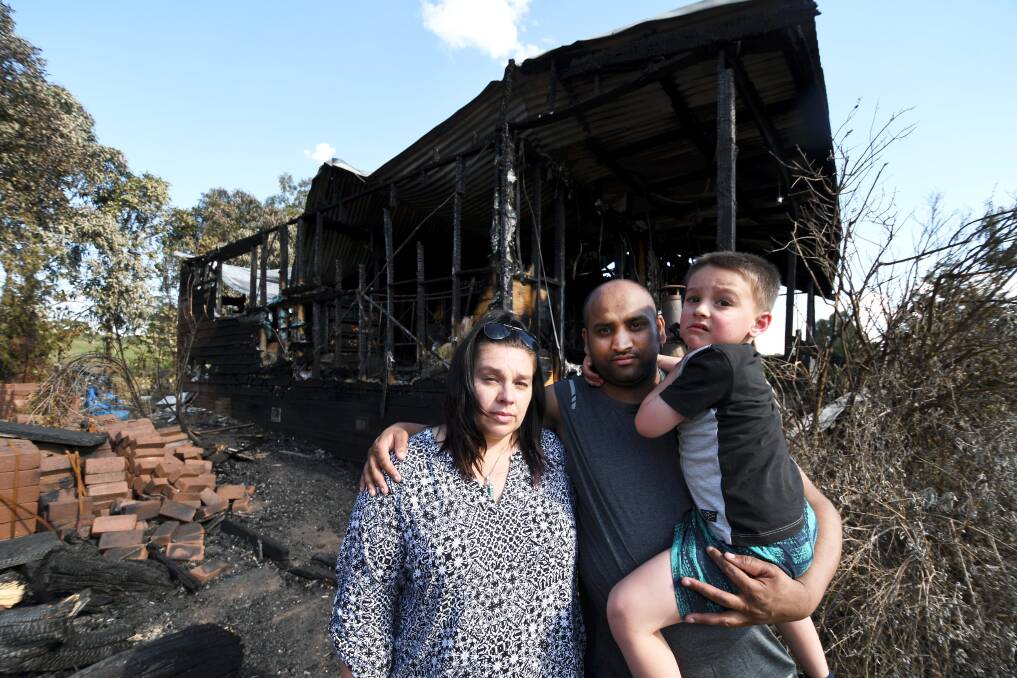 FAMILY: Anita Fabos, Raj Singh and Gabriel Singh, 4, say they are lucky to be alive after a massive fire tore through their Sulky home on Saturday morning. Picture: Lachlan Bence.