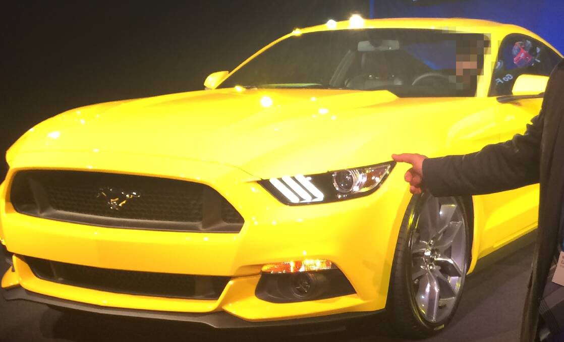 A file photo of a yellow Mustang.