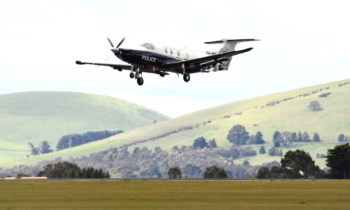 The South Australian police plane carrying Matthew Tilley flies out of the Ballarat airport. Photo: Adam Trafford.