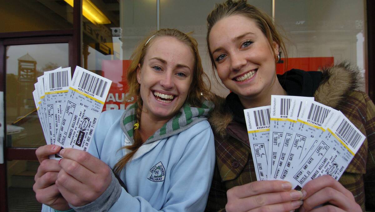 2006 - Fans queue up outside Myers to try and secure tickets for the Robbie Williams concert. Naomi Menhennet and Tegan Johnstone waited since 11:45 pm in their sleeping bags on the pavement outside, to snare 16 tickets, and couldn't have been happier. 