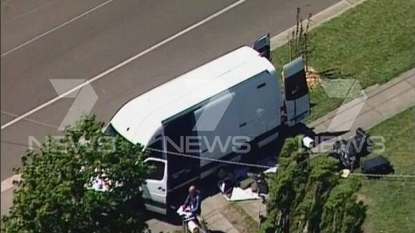 The bomb squad out the front of the Edward Street house. Picture: Channel 7.