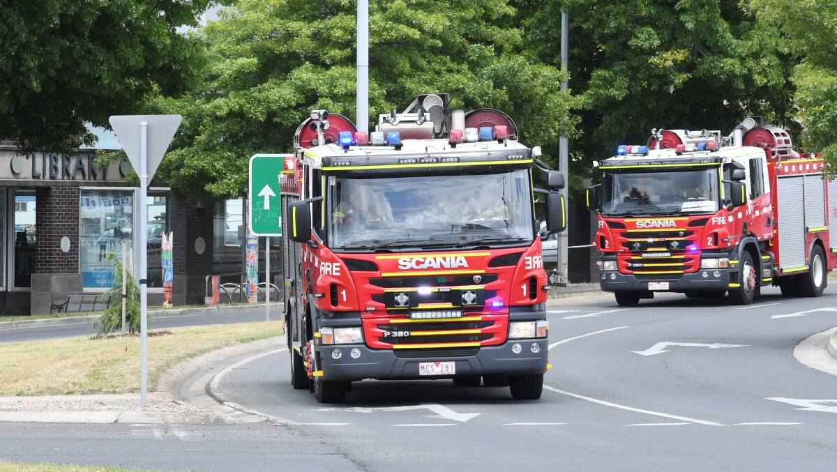 Firetrucks approach the Creswick Road roundabout.