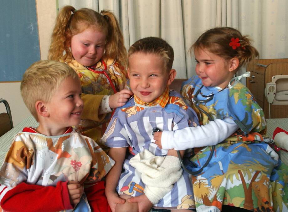 2003 - St Alipius Kinder visit St Johns paediatric unit and play doctors and nurses: Isaac Keating, Hannah Boord, (far right) Meg Taylor examine Matt Willian.
