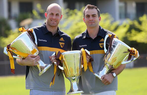 LEGENDS: Retiring Hawthorn duo David Hale and Brian Lake with the three AFL premiership cups they won together. Picture: Getty Images