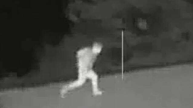Watch the police chopper track two people on the run in dead of night