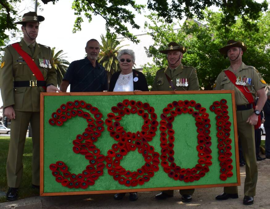 PAYING RESPECT: Sergeant Daniel Purcell, Burno Bomitali, Ann Carr, Major John Spencer, Alec Kincaie with the tribute to Ballarat and District servicemen and women who fought in World War I. Picture: Sam Shalders.