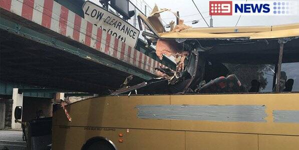 The Gold Bus logo on the bus has been covered in tape. Source: 9 News.