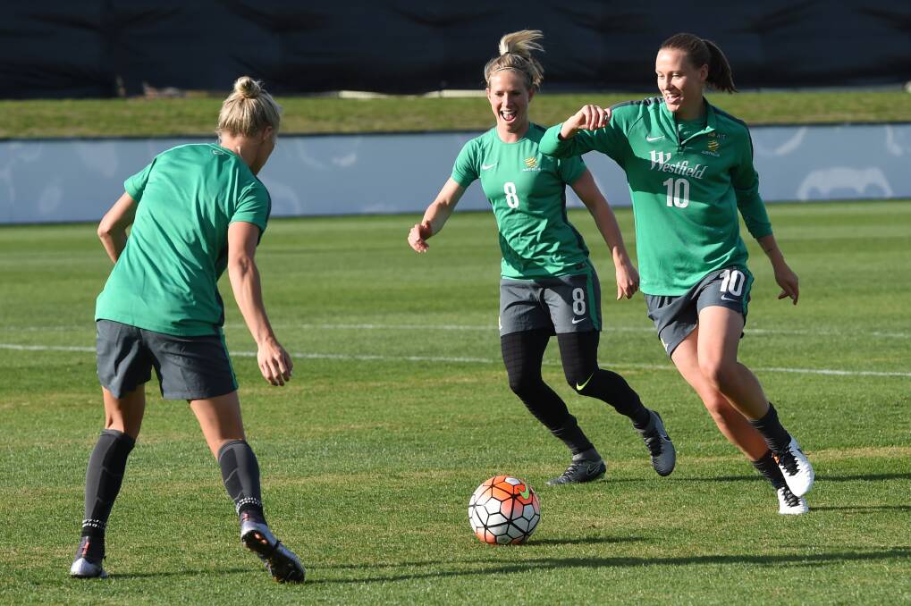 Tameka Butt, Elise Kellond-Knight and Emily van Egmond in action at training at Morshead Park. Picture: Kate Healy.