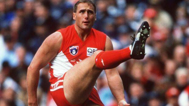 On staff: Tony Lockett in action for the Swans against Geelong in 1998. Photo: Tony Feder