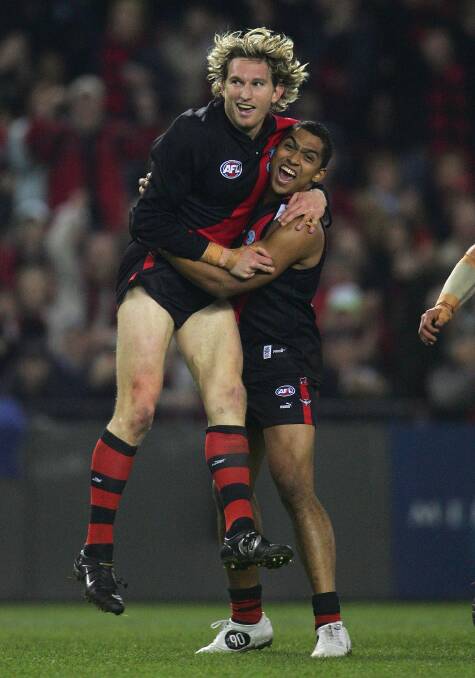 Essendon legend James Hird and Damian Cupido in 2005.