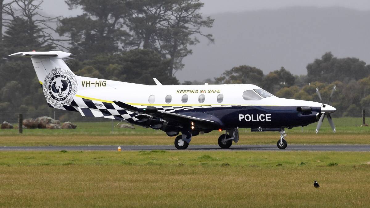 The South Australian police plane carrying Matthew Tilley on the tarmac at of the Ballarat airport. Photo: Adam Trafford.