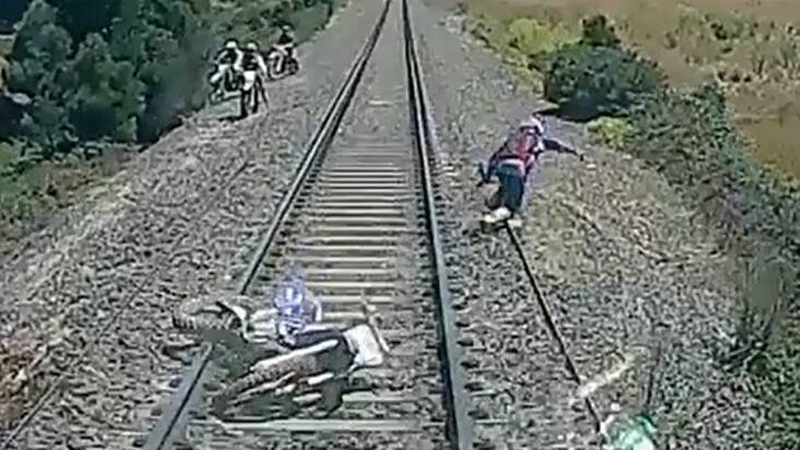 Idiot biker seconds from death on Ballan train tracks | Video, Audio