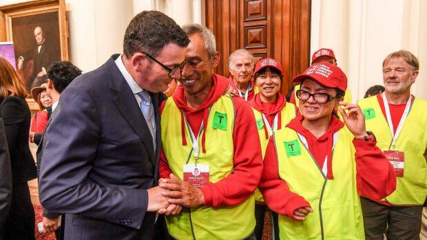 Premier Daniel Andrews with one of the walk organisers, Ballarat's Charles Zhang, after the apology. Photo: Justin McManus.
