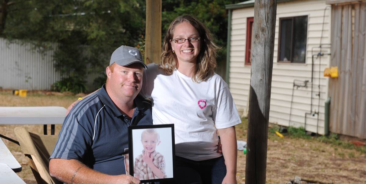 LEGACY: Jon and Michelle Seccull hold a picture of their son Ethan. The couple are urging families to talk to their loved ones about organ donation and consider joining the Australian Organ Donor Register. Picture: Kate Healy