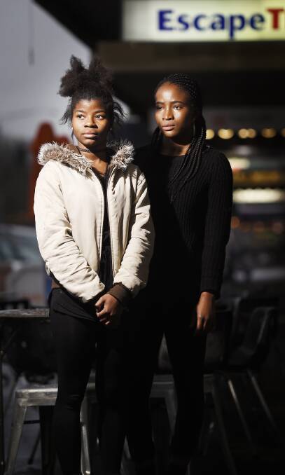 DEVASTATED: Benedicta Amedegnato, 18, and Peace Douhadji, 19 were racially vilified by a man and a woman walking their dog along Sturt Street. Picture: Luka Kauzlaric