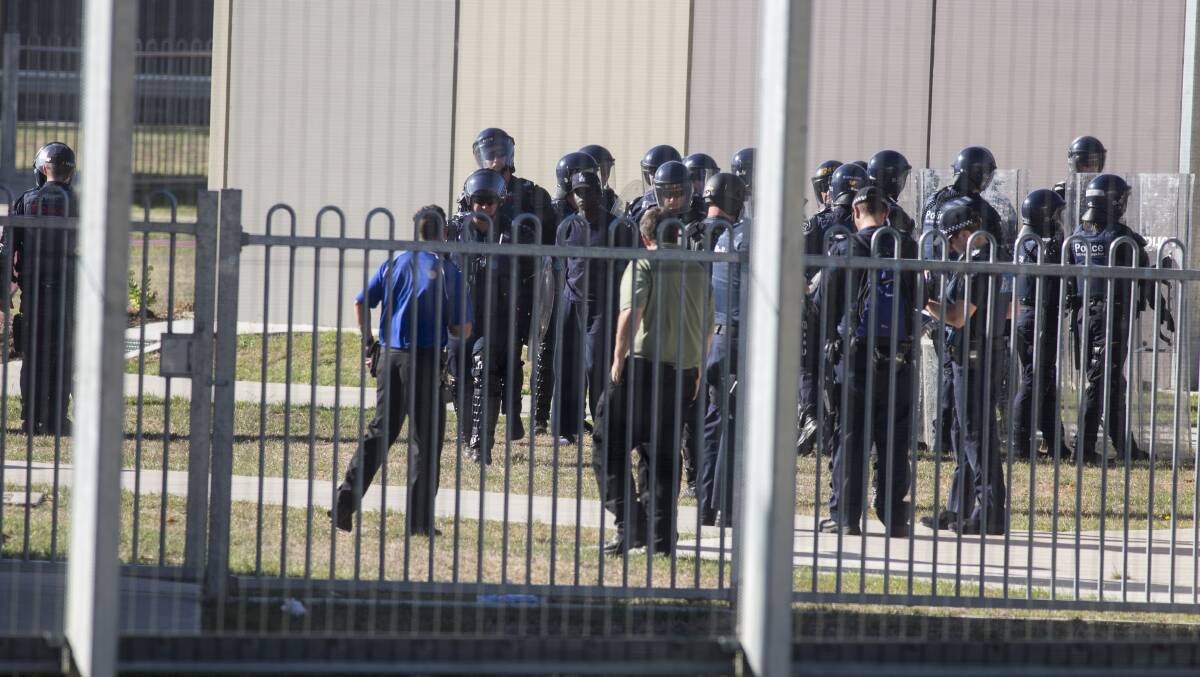 Police are seen during riots at the Malmsbury Youth Justice Centre on January 25. Picture: Paul Jeffers, Fairfax Media