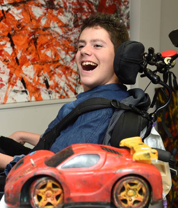SPECTACULAR SHOW: Ballarat Specialist School student, Lucas Roberts, 17, will unveil his first art exhibition on Wednesday night. The series of unqiue paintings were created using a remote control car. Picture: Lachlan Bence.