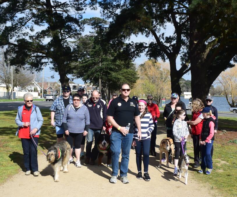 WORTHY CAUSE: Event organiser Ron Chapman (centre) lead hundreds of people taking part in the city's first Walk for Stroke event at Lake Wendouree.
