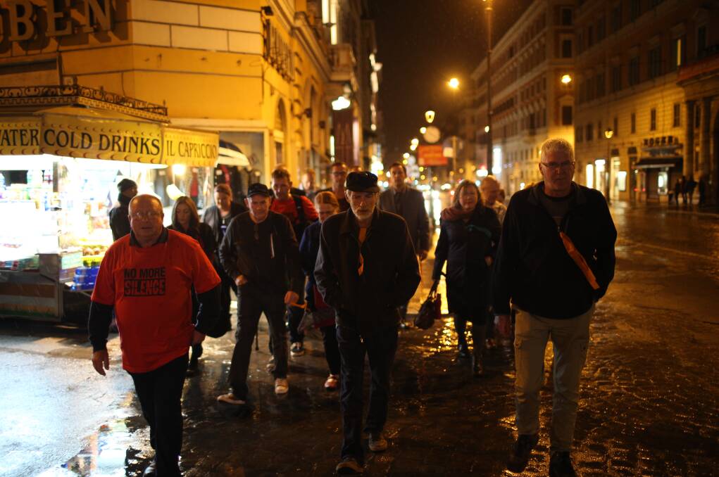 EPIC JOURNEY: Clergy sexual abuse survivors Tony Wardley, Paul Auchettl and Phil Nagle lead the group en-route to the royal commission in Rome.