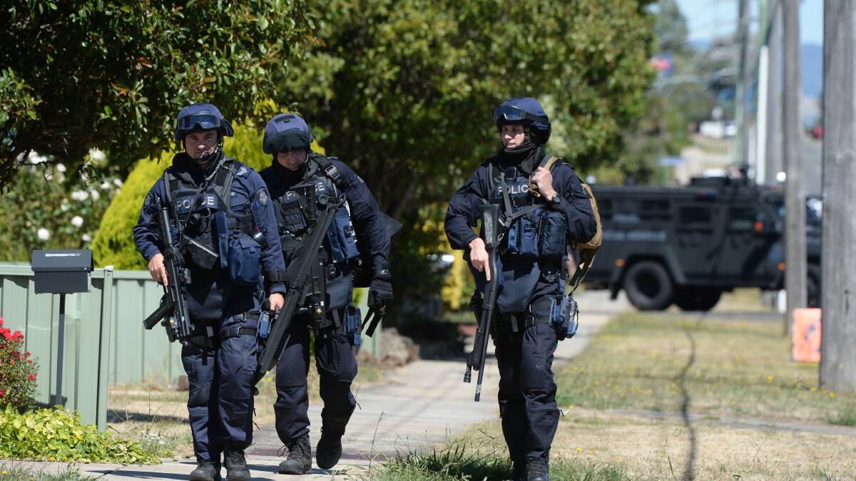 Critical Incident Response Team are about to enter a house in Wendouree. Picture: Kate Healy. 