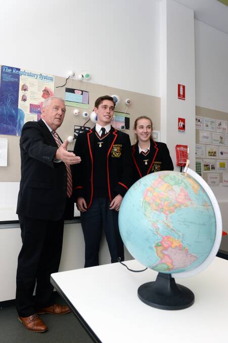 FRESH LOOK: Principal David Shepherd and year 12 captains Jack Kinnersly and Kate Lyons check out Clarendon College's new science room. Picture: Kate Healy