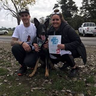 BIG WALK: Duke's owners Lee Crawley and Georgia Brennan with their dog Coxie at the RSPCA Million Paws Walk.