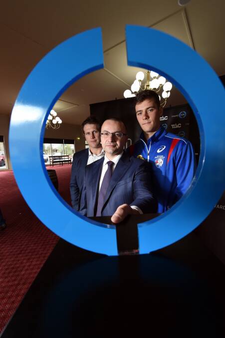 AMBITIOUS TARGET: Former Hawk Campbell Brown, TAC chief executive Joe Calafiore, and Western Bulldog Josh Dunkley in Ballarat. Picture: Jeremy Bannister