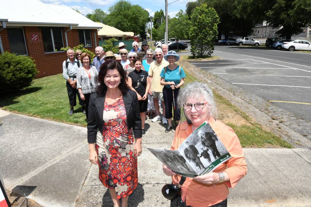 FIRING FIT: Dinah McCance leads residents and Ballarat City Council mayor Samantha McIntosh on a heritage and health walk at Soldiers Hill. Picture: Lachlan Bence