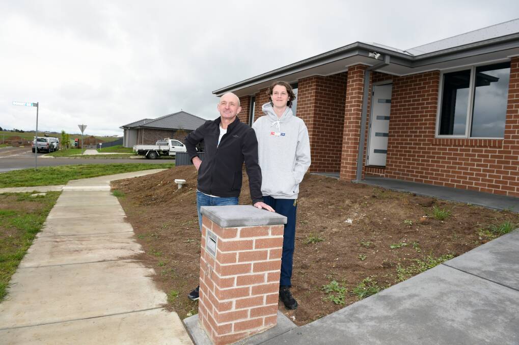 Brian McGurk with son Felix at the family's new home in Ballymanus, one of Ballarat's newest suburbs in the city's booming western growth zone. Picture: Kate Healy 