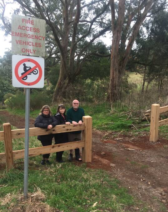 NOT HAPPY: Mount Buninyong residents Michelle Pearson, left, and Phillip Smith, right, say the wooden barrier will endanger residents' lives.