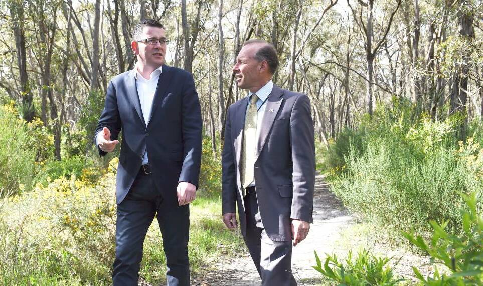 Premier Daniel Andrews and MP Geoff Howard in the park in 2015.