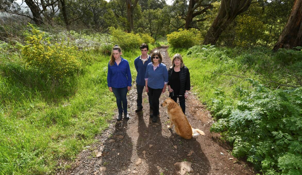 ANGRY: Catherine, Andrew and Libby Cornish, and Michelle Pearson on Blackberry Lane. Picture: Lachlan Bence