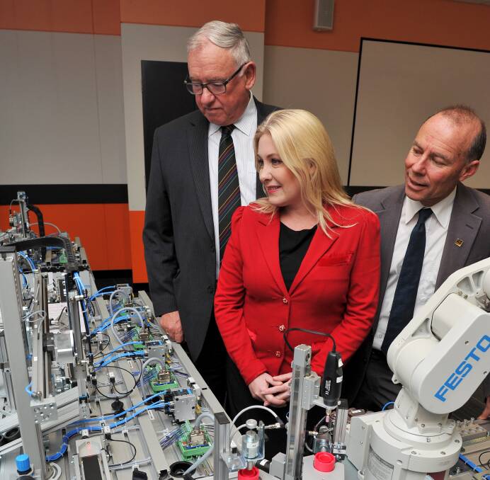 Funding boost: Federation University Chancellor Paul Hemming and Ballarat MPs Sharon Knight and Geoff Howard taking a tour or the facility. Picture: Lachlan Bence