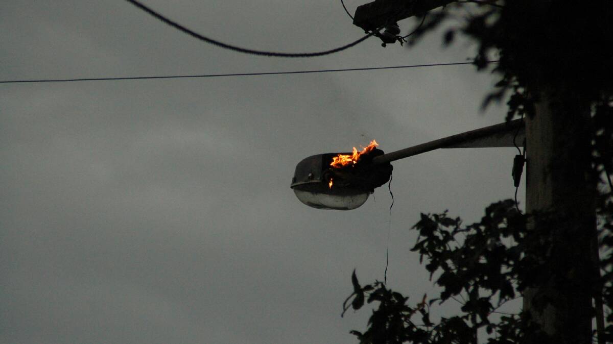 DIRECT HIT:  Lightning hits a street light in East Devonport. Picture: Supplied. 