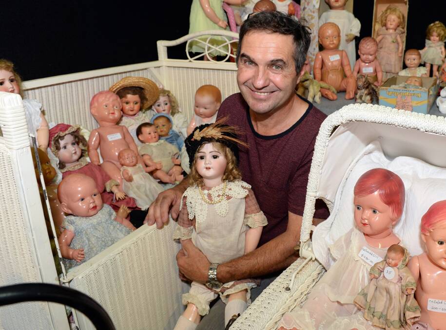 Dolls housed: Tony Braggion, from Ballarat, with his doll collection at the Ballarat Antique Fair on Sunday. PICTURE: Kate Healy