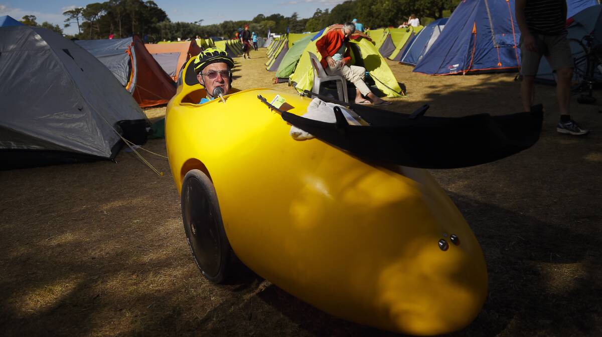 Bruce Hicks in his banana-like velomobile. PICTURE: Luka Kauzlaric
