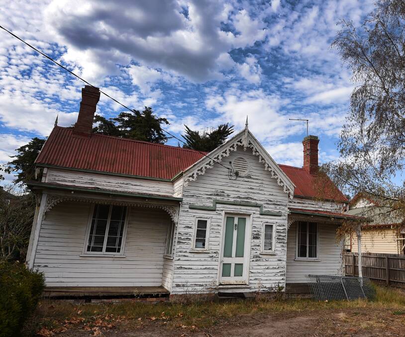 Still standing: The house's future, be it demolished or moved to the Botanical Gardens, is still up in the air. PICTURE: Lachlan Bence