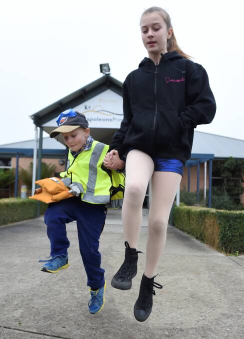 Walking before jumping: Napoleons pupils Lachlan Milne, 6,  and Katelyn Barentsen, 11, at the walkathon on Friday. PICTURE: Lachlan Bence