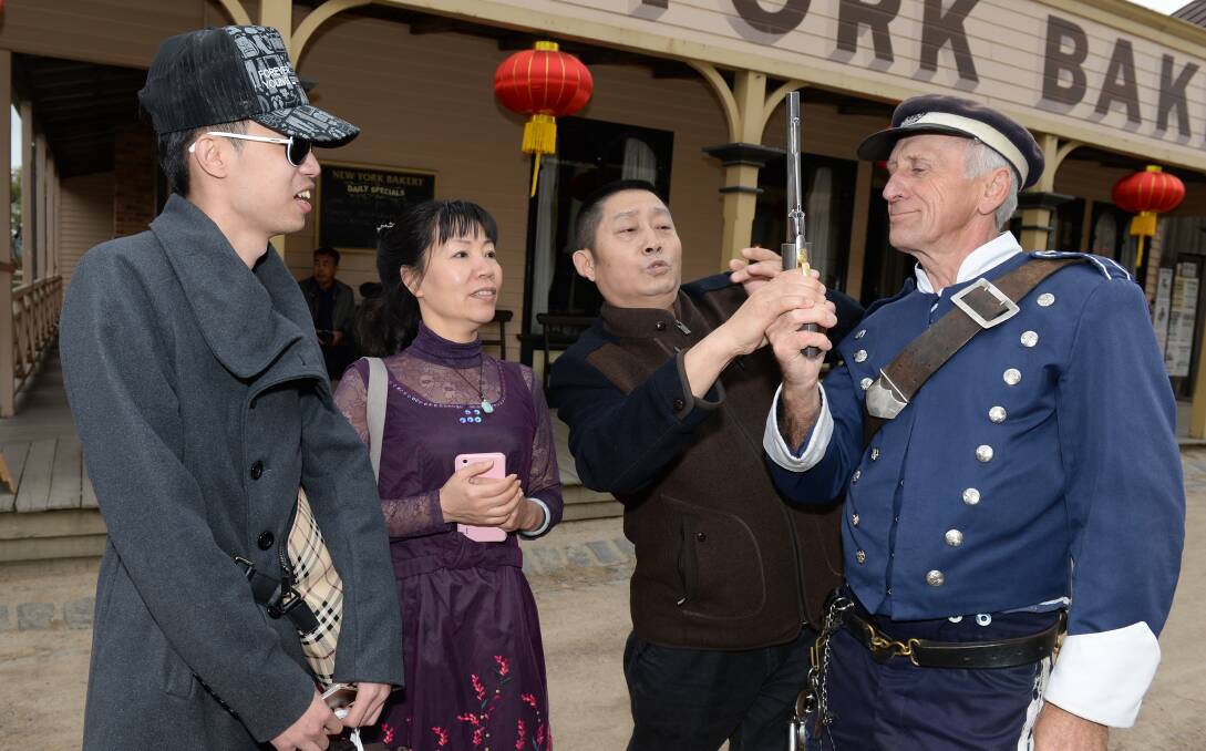 Target market: Li Li, Ming Bian, Guo Qing Li from Wuhan and Sovereign Hill cop Pete Bray. PICTURE: Kate Healy